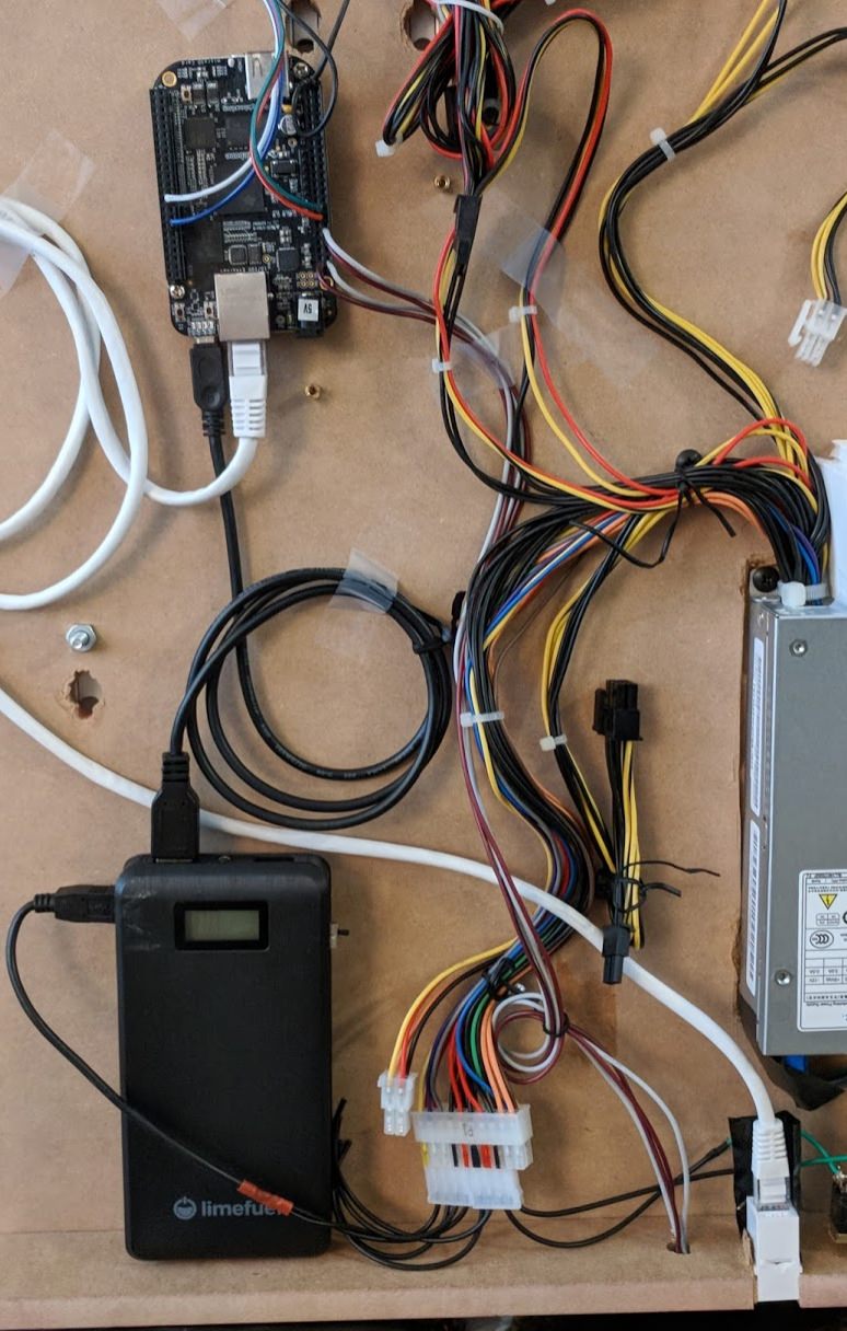 A rats nest of wires on the back of the sign with a slim PC power supply connected to the USB battery bank and then to the Beaglebone Black. Ethernet connected from the Beaglebone Black to the outside with a female receptacle to have a clean look and easy hook-up on the outside.